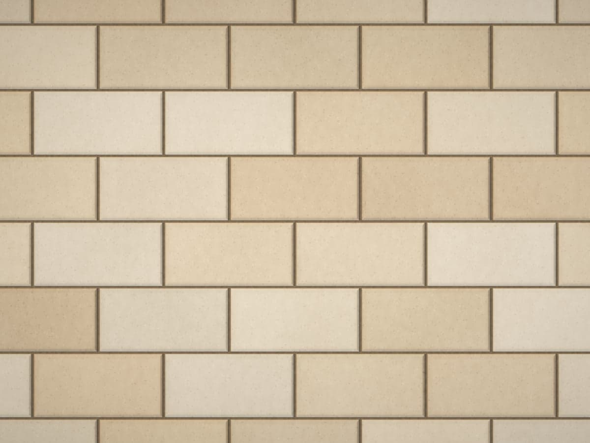 Pavers with joint sand washed out, leaving dark, open joints.