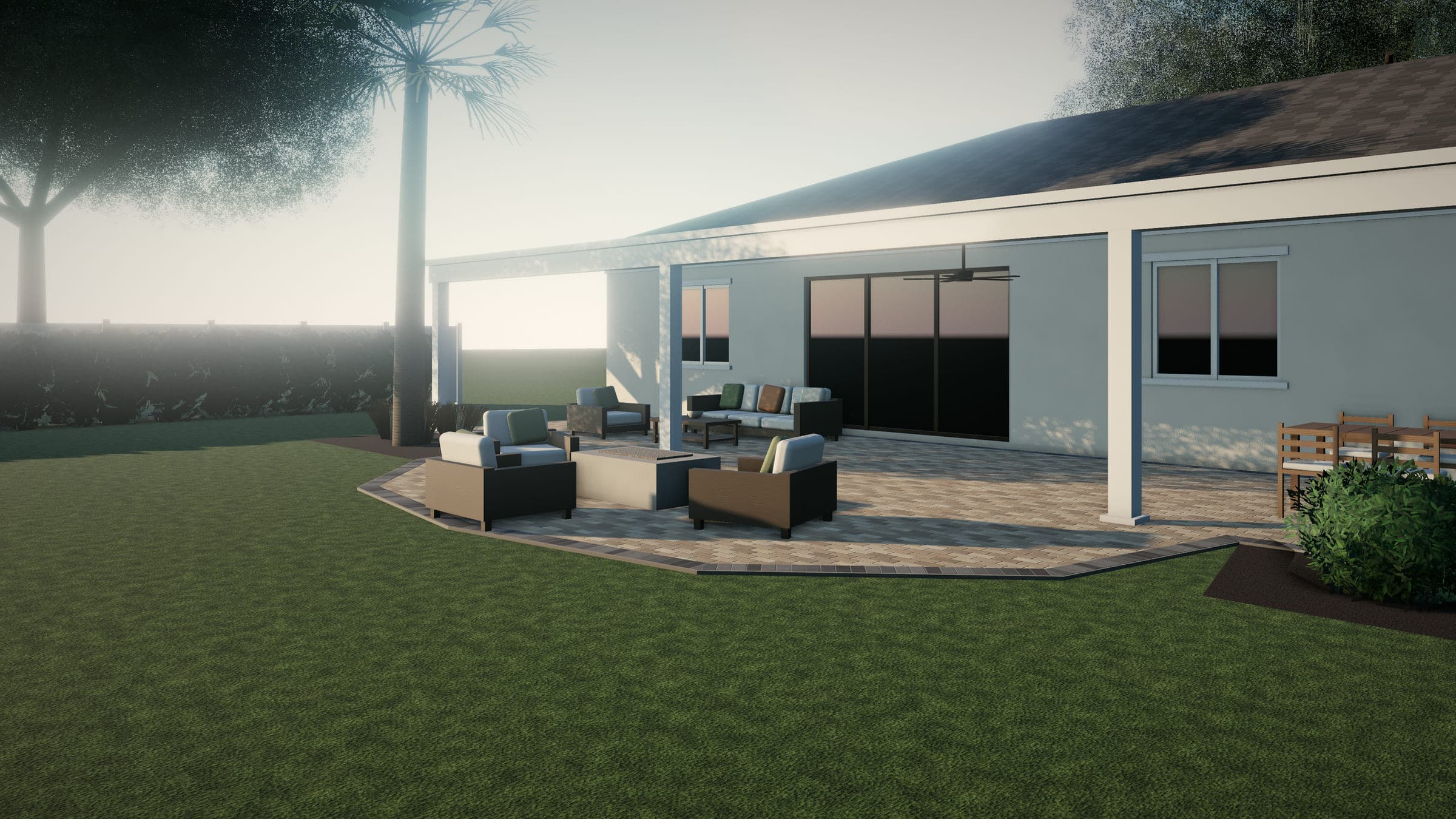 Solid patio cover with a ceiling fan over lounge and dining furniture, with pavers extending past the cover to an open seating area around a fire table.
